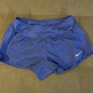 Blue Nike women’s shorts, small tear